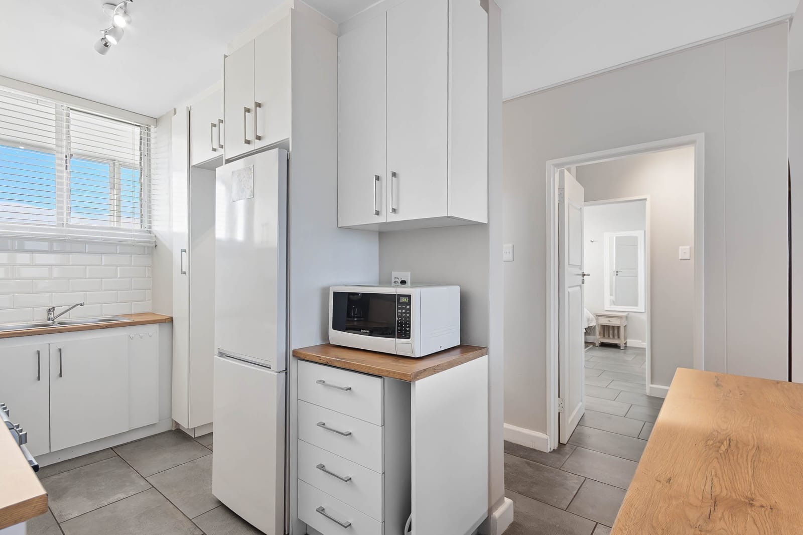 Kitchen with microwave and fridge-freezer