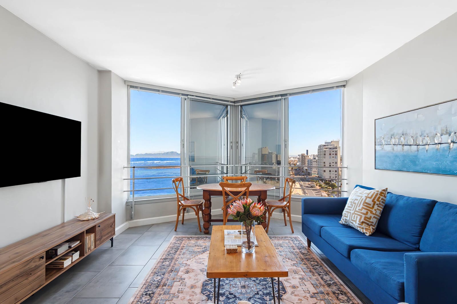 Open-plan living and dining area with False Bay view